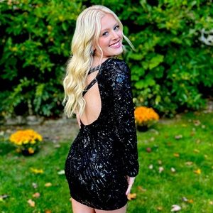 This is a Breeze Bridal dress, black, black sequins! Also in a size 2!